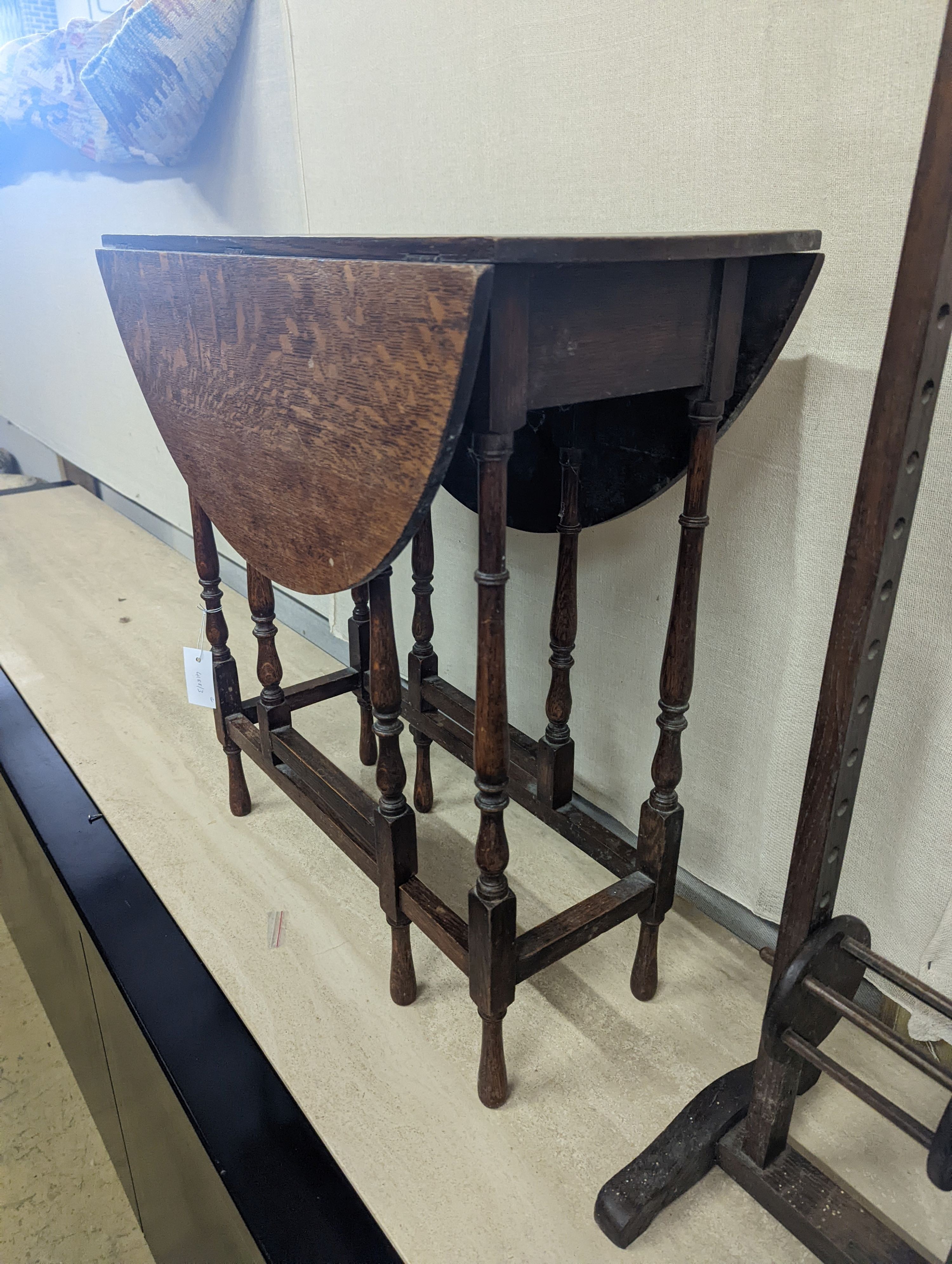 A Sutherland spider leg table and bobbin/wool winder, height 105cm